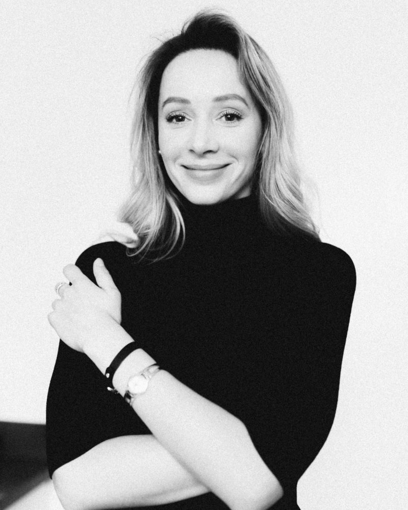 Marina Petrenko, founder of OutGeek Women in Tech, smiling in a black turtleneck